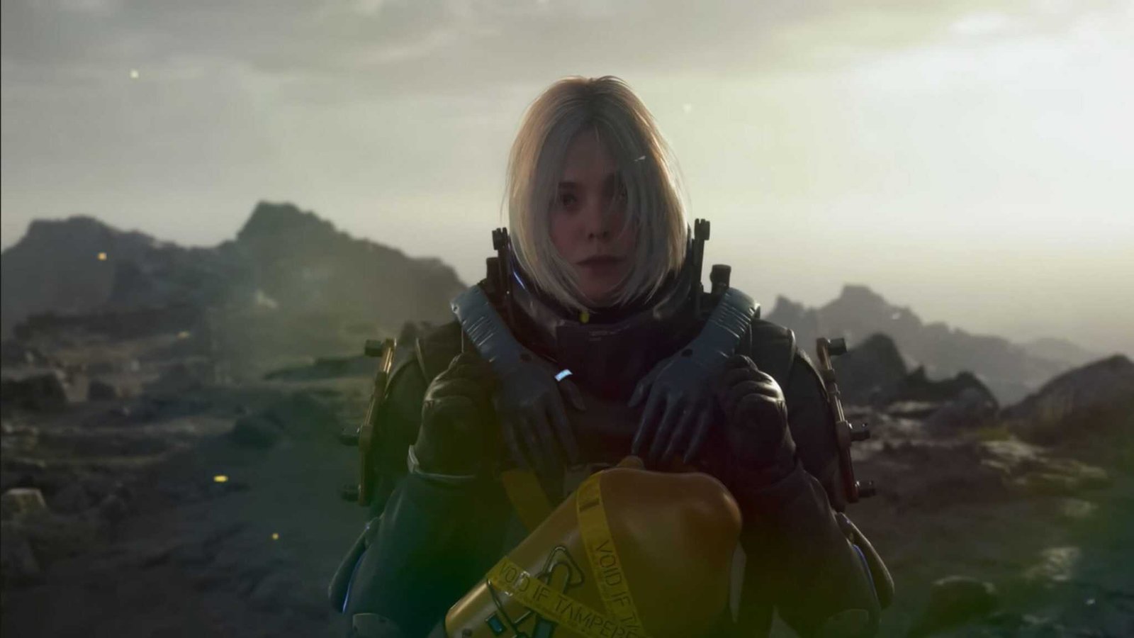 Young blonde woman standing in a desert-like setting