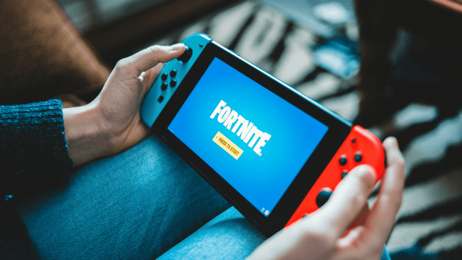 Nintendo Switch handheld playing Fortnite on screen