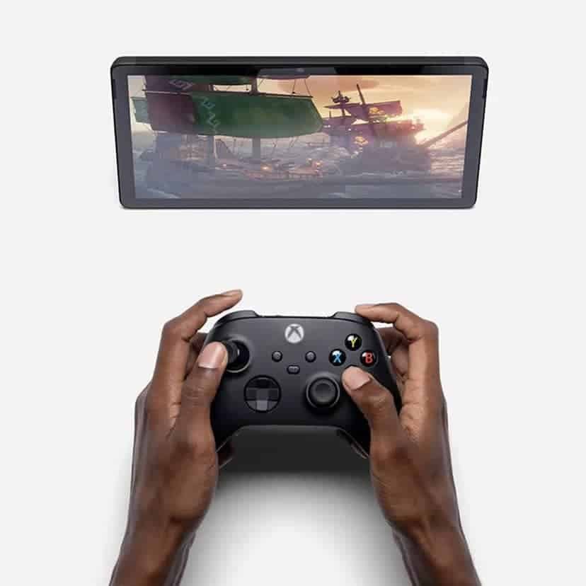 Xbox controller and mobile devices showing game icons