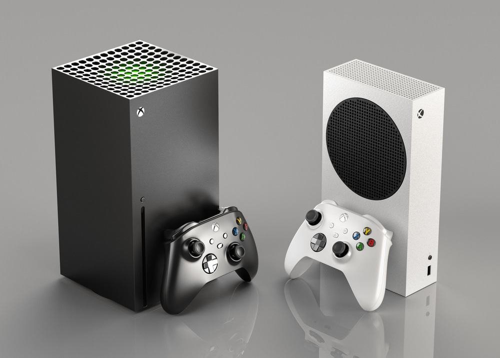 Two Xbox consoles side by side with their controllers