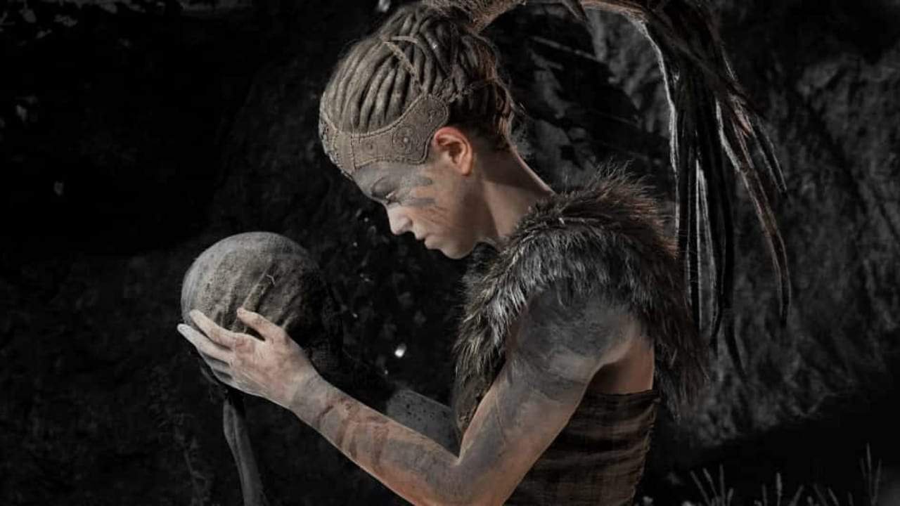 Senua standing in a somber landscape, reflecting the game’s psychological themes