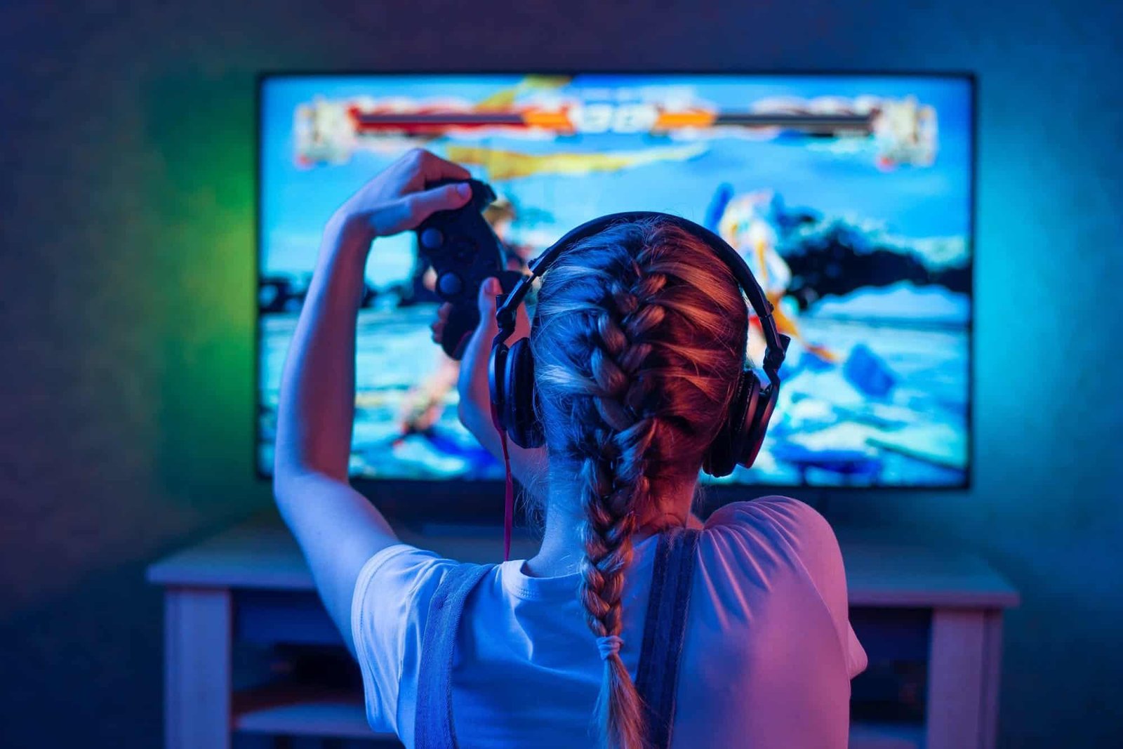 Woman gaming with headset, representing concerns about harassment and gender disclosure