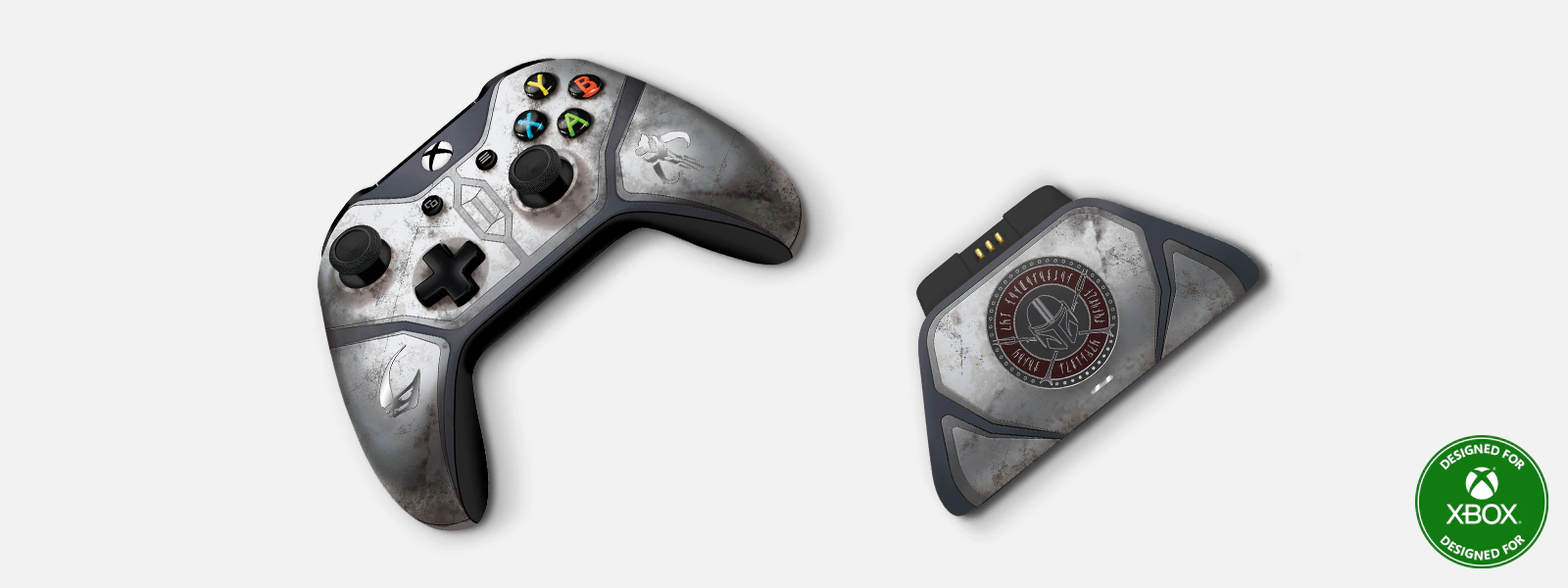The Mandalorian-themed Xbox controller and charger on an orange and blue background